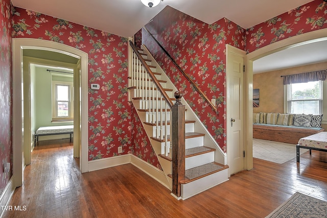 15497 Porterfield Hwy, Abingdon, VA 24210 - stairway with hardwood / wood-style floors, arched walkways, and baseboards