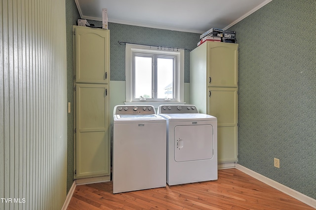 15497 Porterfield Hwy, Abingdon, VA 24210 - laundry area with crown molding, cabinet space, washer and dryer, wallpapered walls, and light wood finished floors