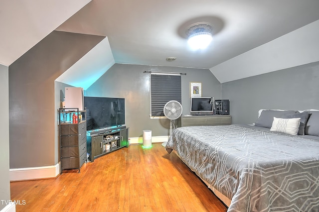 15497 Porterfield Hwy, Abingdon, VA 24210 - bedroom featuring baseboards, vaulted ceiling, and wood finished floors