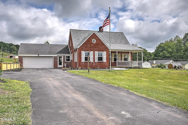 15497 Porterfield Hwy, Abingdon, VA 24210 - view of front of home featuring brick siding, a porch, asphalt driveway, a front lawn, and an attached garage