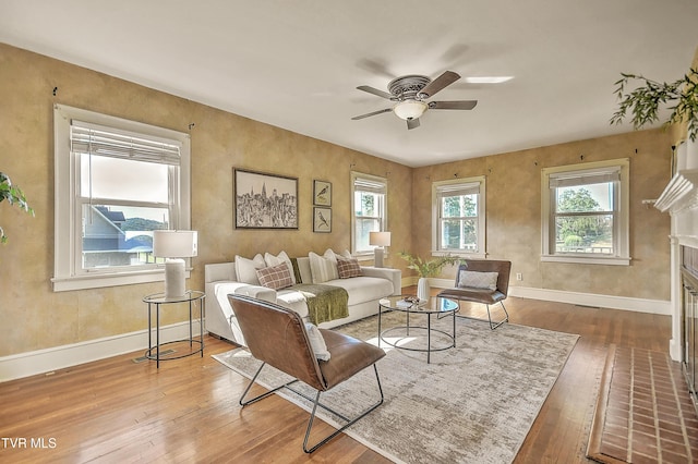 15497 Porterfield Hwy, Abingdon, VA 24210 - living area featuring wood-type flooring, a ceiling fan, and a fireplace with flush hearth