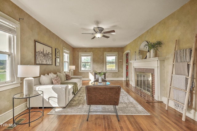 15497 Porterfield Hwy, Abingdon, VA 24210 - living area with hardwood / wood-style flooring, a ceiling fan, and a fireplace