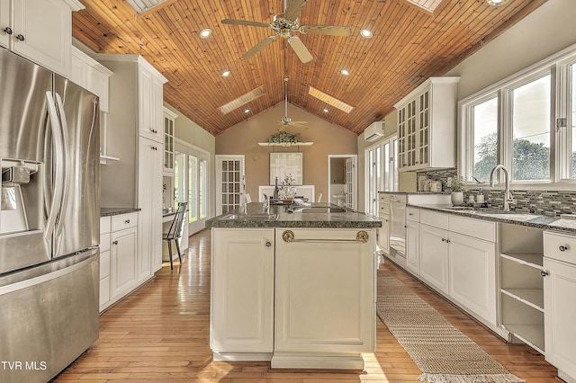 15497 Porterfield Hwy, Abingdon, VA 24210 - kitchen with stainless steel refrigerator with ice dispenser, a ceiling fan, a center island, lofted ceiling, and light wood-type flooring