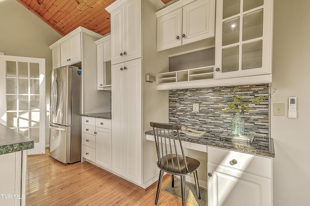15497 Porterfield Hwy, Abingdon, VA 24210 - kitchen featuring freestanding refrigerator, wood ceiling, light wood-type flooring, tasteful backsplash, and white cabinets