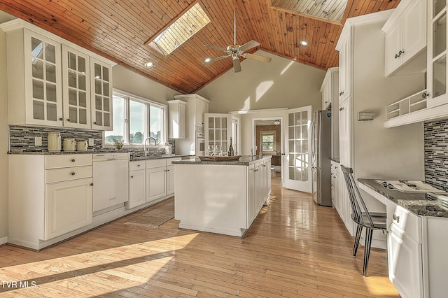 15497 Porterfield Hwy, Abingdon, VA 24210 - kitchen featuring dishwasher, freestanding refrigerator, wooden ceiling, a kitchen island, and decorative backsplash