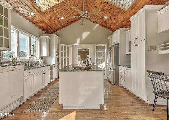 15497 Porterfield Hwy, Abingdon, VA 24210 - kitchen with appliances with stainless steel finishes, a ceiling fan, a center island, dark countertops, and wood ceiling