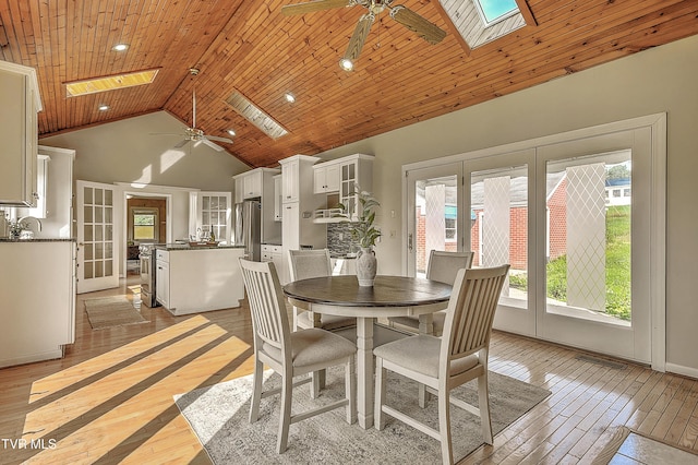 15497 Porterfield Hwy, Abingdon, VA 24210 - dining room with a skylight, a ceiling fan, light wood-style flooring, high vaulted ceiling, and recessed lighting
