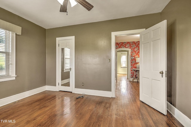 15497 Porterfield Hwy, Abingdon, VA 24210 - unfurnished room with ceiling fan, wood-type flooring, and arched walkways