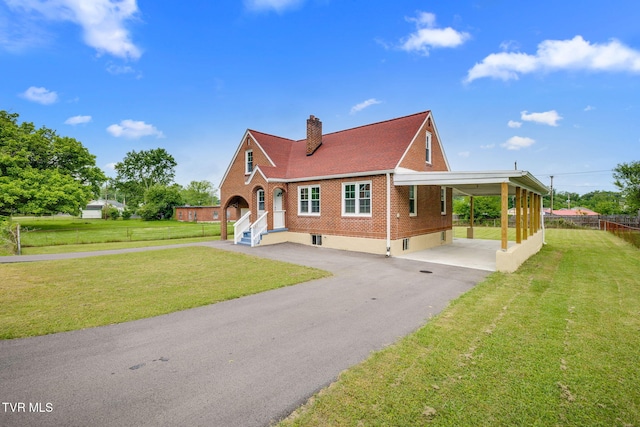 3224 Clover St, Kingsport, TN 37664 - view of front of property with driveway, brick siding, a chimney, and an attached carport