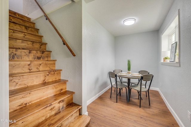 3224 Clover St, Kingsport, TN 37664 - dining space featuring stairs, wood finished floors, a textured wall, and baseboards