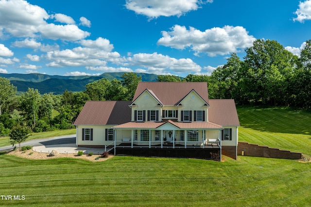 7540 Erwin Hwy, Chuckey, TN 37641 - farmhouse-style home featuring a porch, a front yard, metal roof, and a mountain view