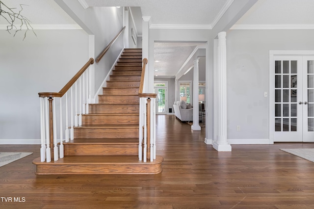 7540 Erwin Hwy, Chuckey, TN 37641 - stairs featuring ornate columns, wood finished floors, french doors, a textured ceiling, and ornamental molding
