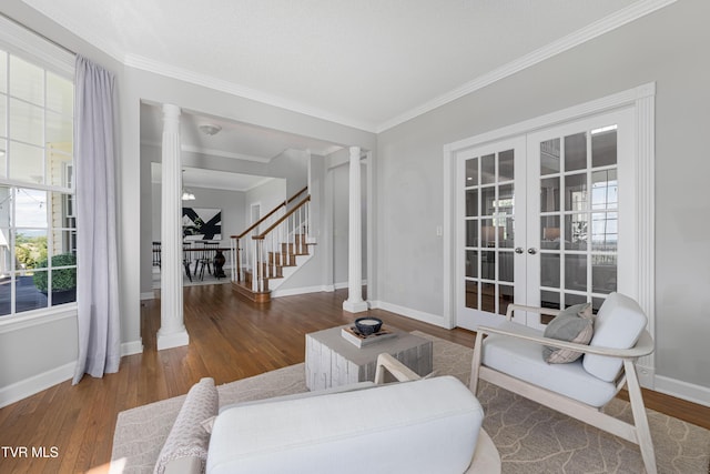 7540 Erwin Hwy, Chuckey, TN 37641 - living area featuring stairway, ornamental molding, wood finished floors, decorative columns, and baseboards