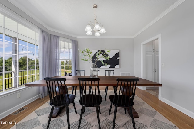 7540 Erwin Hwy, Chuckey, TN 37641 - dining room with a chandelier, crown molding, baseboards, and wood finished floors