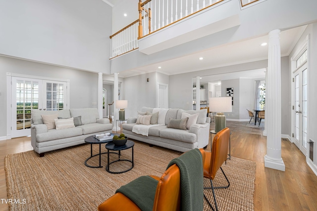 7540 Erwin Hwy, Chuckey, TN 37641 - living room featuring decorative columns, wood finished floors, baseboards, a high ceiling, and recessed lighting