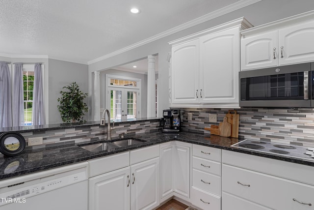 7540 Erwin Hwy, Chuckey, TN 37641 - kitchen featuring dishwasher, stainless steel microwave, a sink, electric cooktop, and dark stone countertops