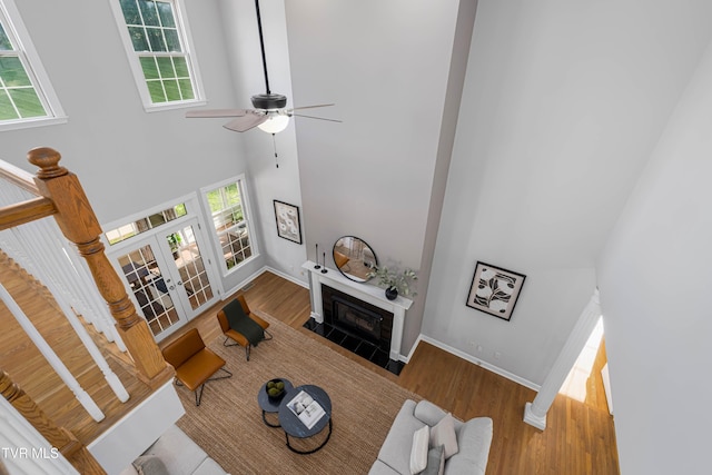 7540 Erwin Hwy, Chuckey, TN 37641 - living area featuring a towering ceiling, wood finished floors, healthy amount of natural light, and french doors