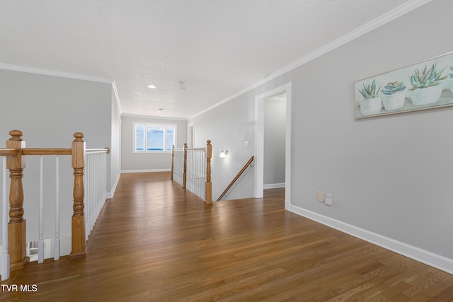 7540 Erwin Hwy, Chuckey, TN 37641 - empty room featuring ornamental molding, wood finished floors, baseboards, and a textured ceiling