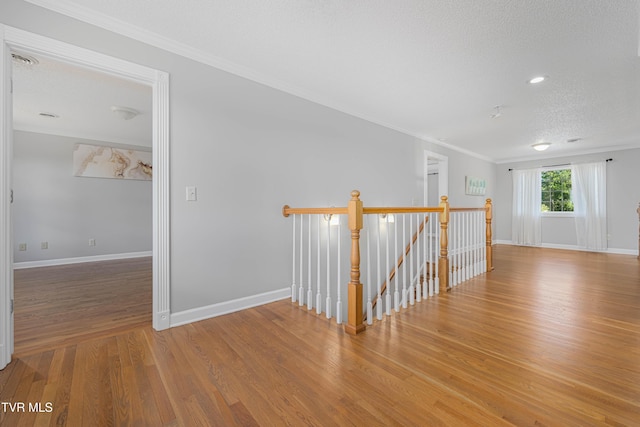 7540 Erwin Hwy, Chuckey, TN 37641 - empty room with wood finished floors, ornamental molding, baseboards, and a textured ceiling