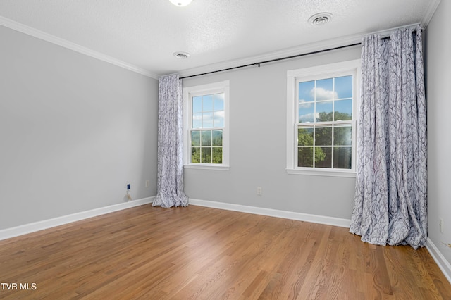 7540 Erwin Hwy, Chuckey, TN 37641 - unfurnished room with ornamental molding, a textured ceiling, wood finished floors, and baseboards