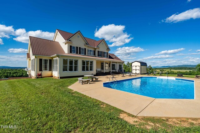 7540 Erwin Hwy, Chuckey, TN 37641 - back of house featuring a patio, a yard, an outdoor pool, and metal roof