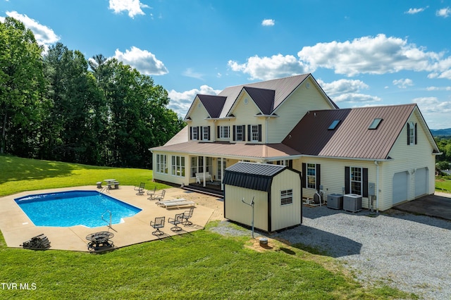 7540 Erwin Hwy, Chuckey, TN 37641 - rear view of property featuring metal roof, a yard, central AC, and a patio
