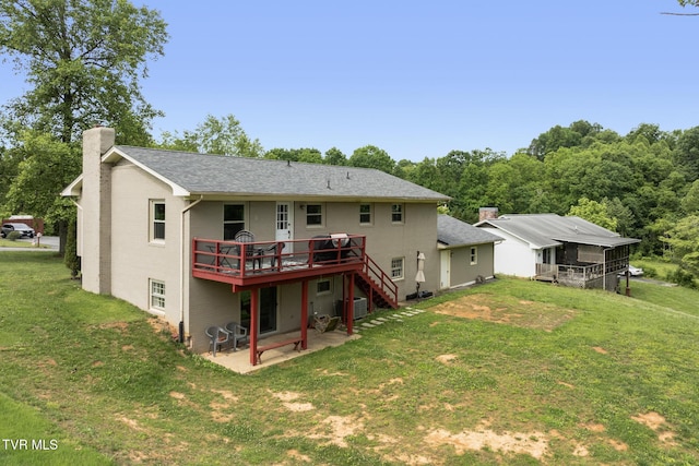 405 Castaway Dr, Kingsport, TN 37663 - back of house with a chimney, a deck, a patio area, a lawn, and brick siding