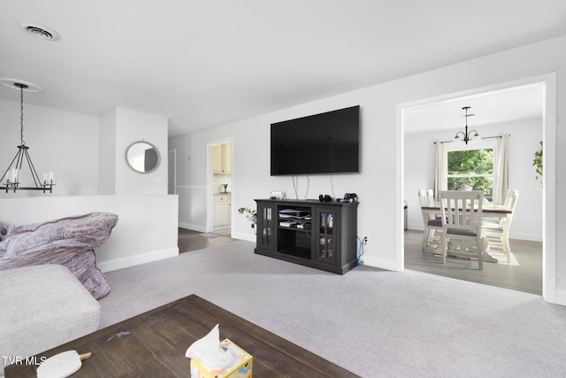405 Castaway Dr, Kingsport, TN 37663 - carpeted living area featuring a chandelier and baseboards
