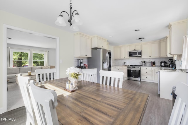 405 Castaway Dr, Kingsport, TN 37663 - dining room featuring a chandelier and wood finished floors