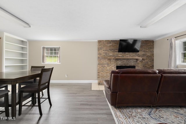 405 Castaway Dr, Kingsport, TN 37663 - living room with wood finished floors, a fireplace, baseboards, and ornamental molding