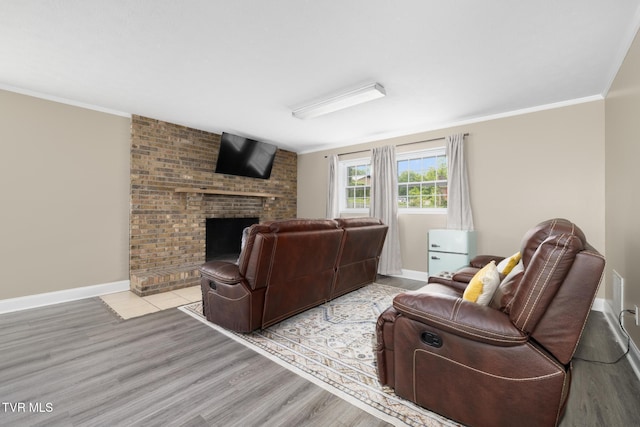 405 Castaway Dr, Kingsport, TN 37663 - living room with wood finished floors, crown molding, a brick fireplace, and baseboards