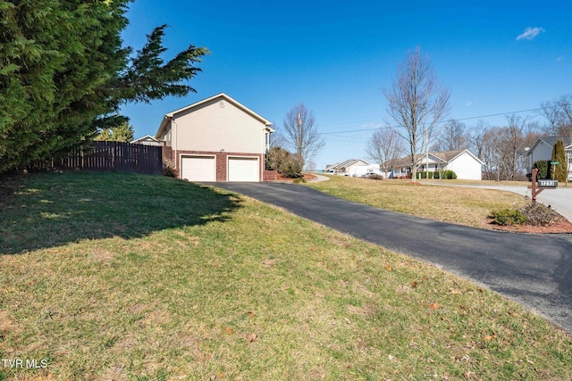 1213 American Way, Jonesborough, TN 37659 - view of property exterior with a garage, asphalt driveway, and brick siding