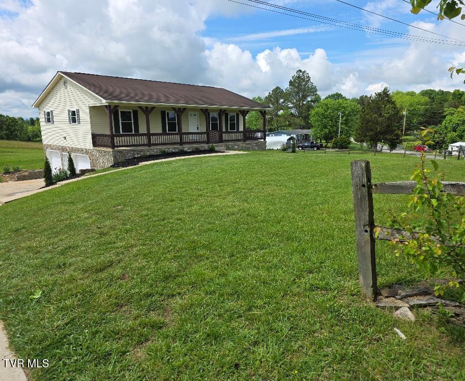 20 Weems Chapel Cv, Mosheim, TN 37818 - ranch-style house with a porch, a garage, and a front lawn