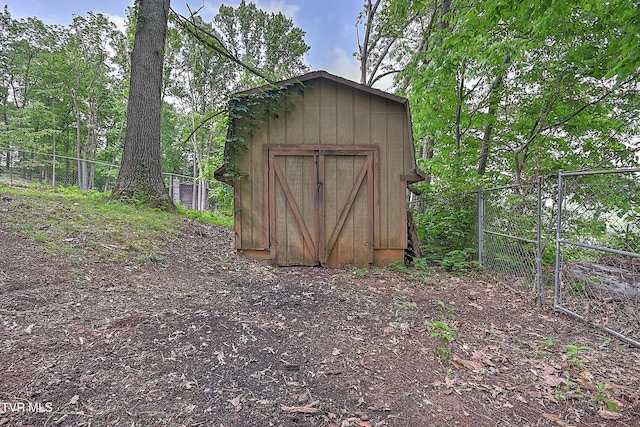view of shed with fence