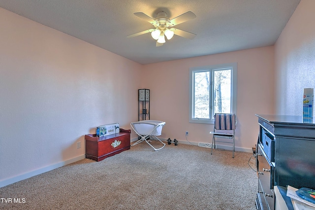 miscellaneous room featuring ceiling fan, carpet, and baseboards