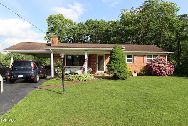 16319 Mary St, Abingdon, VA 24210 - ranch-style house with brick siding, a chimney, a front yard, driveway, and a carport