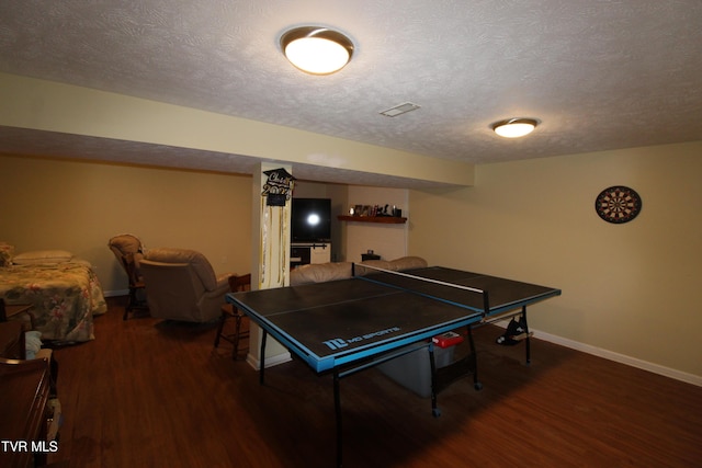 16319 Mary St, Abingdon, VA 24210 - game room featuring wood finished floors, baseboards, and a textured ceiling