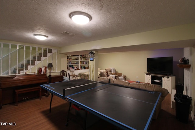 16319 Mary St, Abingdon, VA 24210 - recreation room with a textured ceiling and wood finished floors