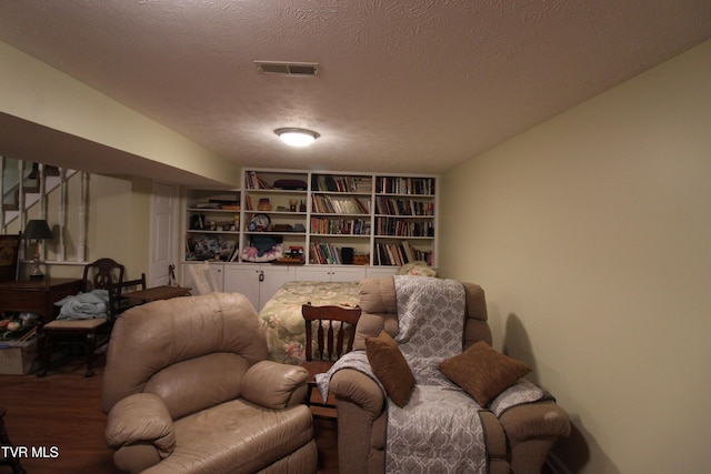 16319 Mary St, Abingdon, VA 24210 - sitting room with wood finished floors, stairs, and a textured ceiling
