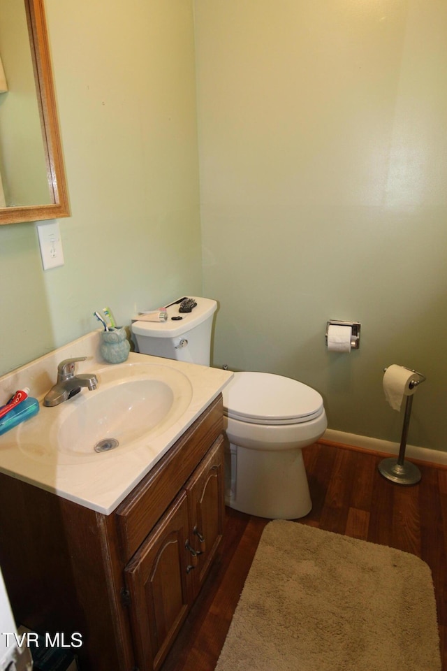 16319 Mary St, Abingdon, VA 24210 - bathroom featuring toilet, wood finished floors, vanity, and baseboards
