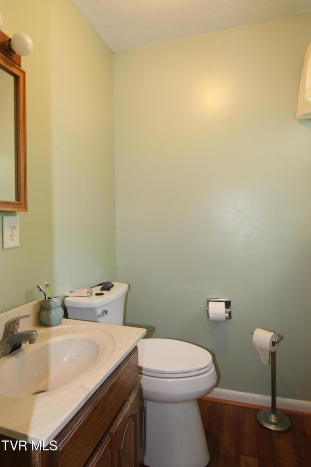 16319 Mary St, Abingdon, VA 24210 - half bath featuring toilet, wood finished floors, vanity, and baseboards