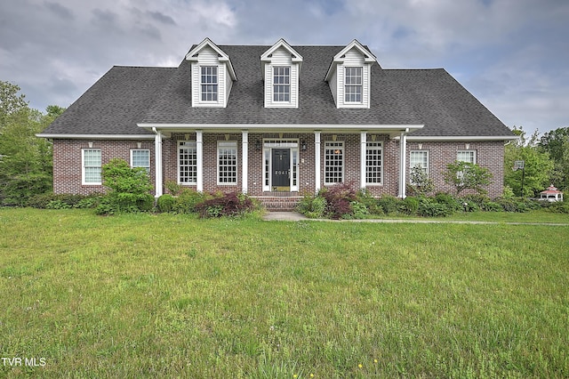 2041 King College Rd, Bristol, TN 37620 - cape cod house featuring brick siding, a front lawn, and a porch