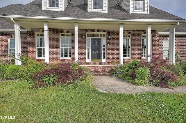 2041 King College Rd, Bristol, TN 37620 - doorway to property featuring a porch, a shingled roof, and brick siding
