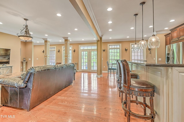 2041 King College Rd, Bristol, TN 37620 - living room with crown molding, light wood-type flooring, recessed lighting, baseboards, and ornate columns