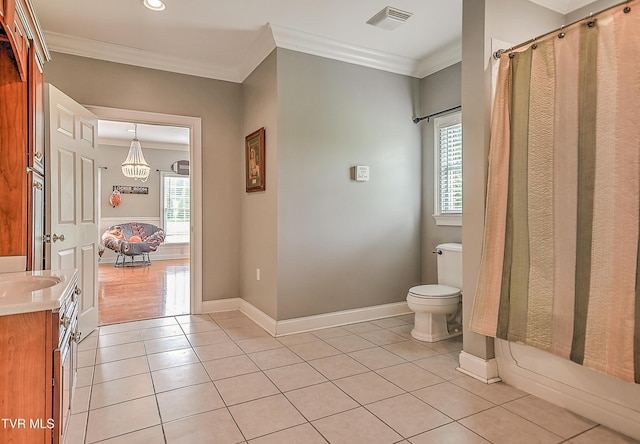2041 King College Rd, Bristol, TN 37620 - full bath with crown molding, tile patterned floors, toilet, a chandelier, and baseboards