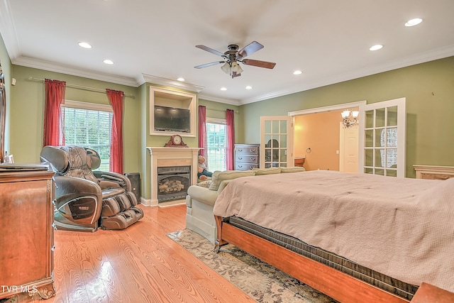 2041 King College Rd, Bristol, TN 37620 - bedroom with light wood-type flooring, recessed lighting, multiple windows, ornamental molding, and a fireplace