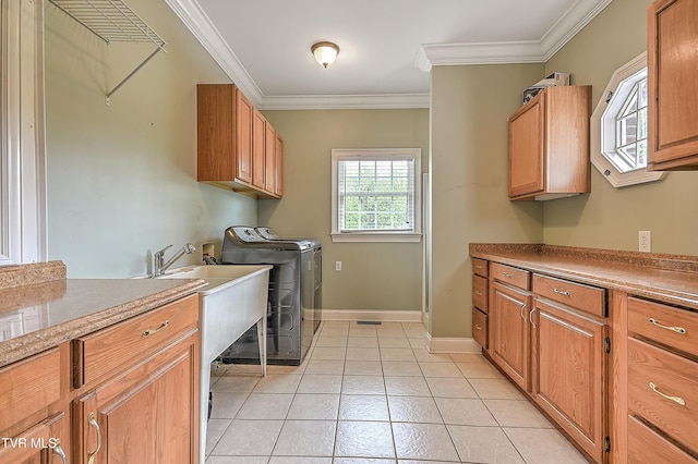 2041 King College Rd, Bristol, TN 37620 - laundry room with independent washer and dryer, cabinet space, ornamental molding, light tile patterned floors, and baseboards