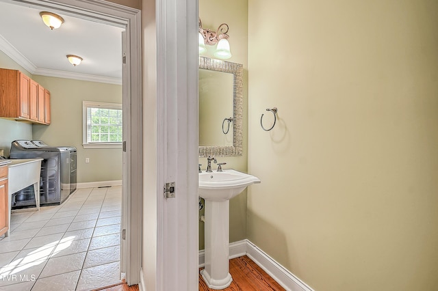 2041 King College Rd, Bristol, TN 37620 - bathroom with separate washer and dryer, ornamental molding, baseboards, and tile patterned floors