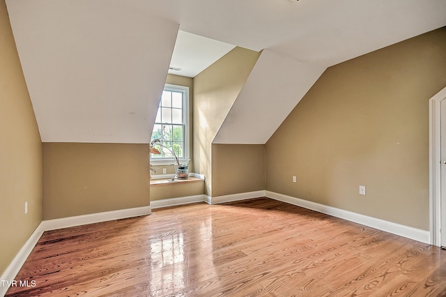 2041 King College Rd, Bristol, TN 37620 - additional living space featuring wood finished floors, vaulted ceiling, and baseboards