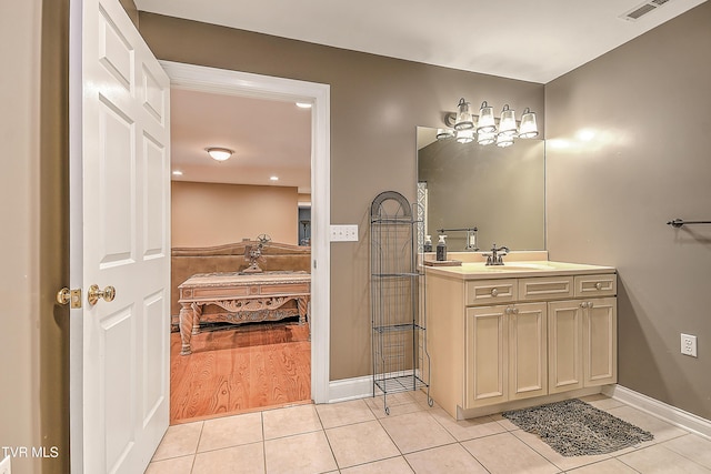 2041 King College Rd, Bristol, TN 37620 - ensuite bathroom with tile patterned flooring, vanity, and baseboards